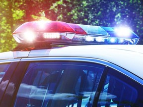 Police car with focus on siren lights. Beautiful siren lights activated in full mission activity. Policemen with patrol car in crime scene intervention operation. Emergency lights are flashing on the patrol car.