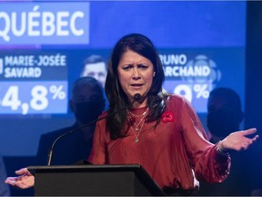 Marie-Josee Savard reacts during her speech at her party headquarters, in Quebec City, Sunday, Nov. 7, 2021. Savard had been confirmed elected and as the ballots were still being counted, she came to a tie and fell behind.