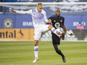 CF Montréal's Kamal Miller, right, challenges Orlando City's Silvester van der Water during first half MLS soccer action in Montreal on Sunday, Nov. 7, 2021.