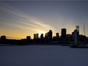 The sun sets behind Montreal's skyline in 2021.