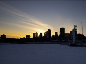 The sun sets behind the Montreal skyline in 2021.