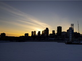 The sun sets behind Montreal's skyline in 2021.