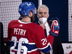 Montreal Canadiens head coach Dominique Ducharme speaks with defenceman Jeff Petry during game against the Ottawa Senators in Montreal on March 2, 2021.
