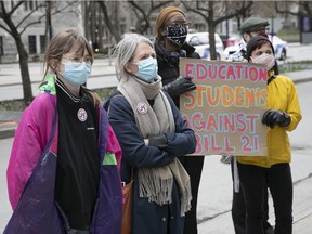 Protesters gathered outside Premier François Legault's office to protest the court's ruling on Bill 21 in Montreal on April 20, 2021.