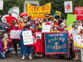 Voters protest to call for federal political parties to commit to a moratorium on new fossil fuel expansion and a sweeping transition to combat climate change in Notre-Dame-de-Grâce Park on Sept. 8, 2021.
