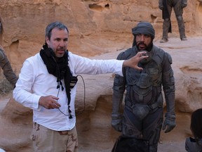 Denis Villeneuve and Javier Bardem on the set of Dune. By mid-December, the sci-fi epic had pulled in close to US$400 million, earning Villeneuve the green light for a second instalment.