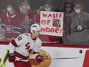 A Montreal Canadiens fan expresses his opinion of former Canadien Jesperi Kotkaniemi during warmup with his Carolina Hurricanes in Montreal on Oct. 21, 2021.