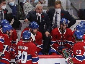 Montreal Canadiens head coach Dominique Ducharme speaks to his players during a game against the New York Islanders in Montreal on Nov. 4, 2021.