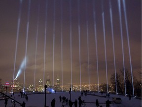 Fourteen beams of light pointing skyward at the top of Mount Royal in Montreal on Dec. 6, 2014, commemorate the 14 women killed in 1989 at the École Polytechnique.