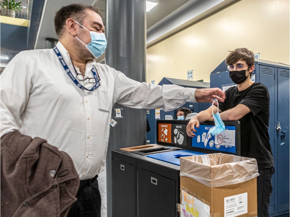  “If you want to do something, it requires a lot of manual labour,” says Nathan McDonald, seen here accepting a used mask from administration member Tristan Aviles. 