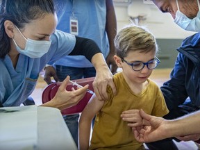 A vaccine dose is administered at a clinic for children age five to 11 at Beurling Acadmey in Verdun on Saturday, November 27, 2021.