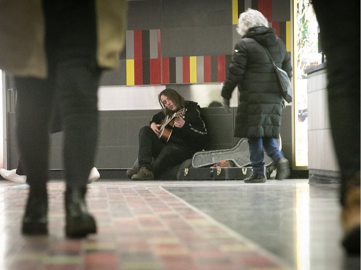  Paul (no last name given) enjoys some quiet time while playing his guitar at Guy-Concordia.