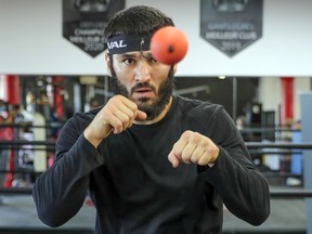 WBC/IBF light-heavyweight champion Artur Beterbiev punches a ball on a tether connected to his head while training at Ramsay Boxing Academy in Montreal on Dec. 1, 2021 in preparation for his coming fight at the Bell Centre.