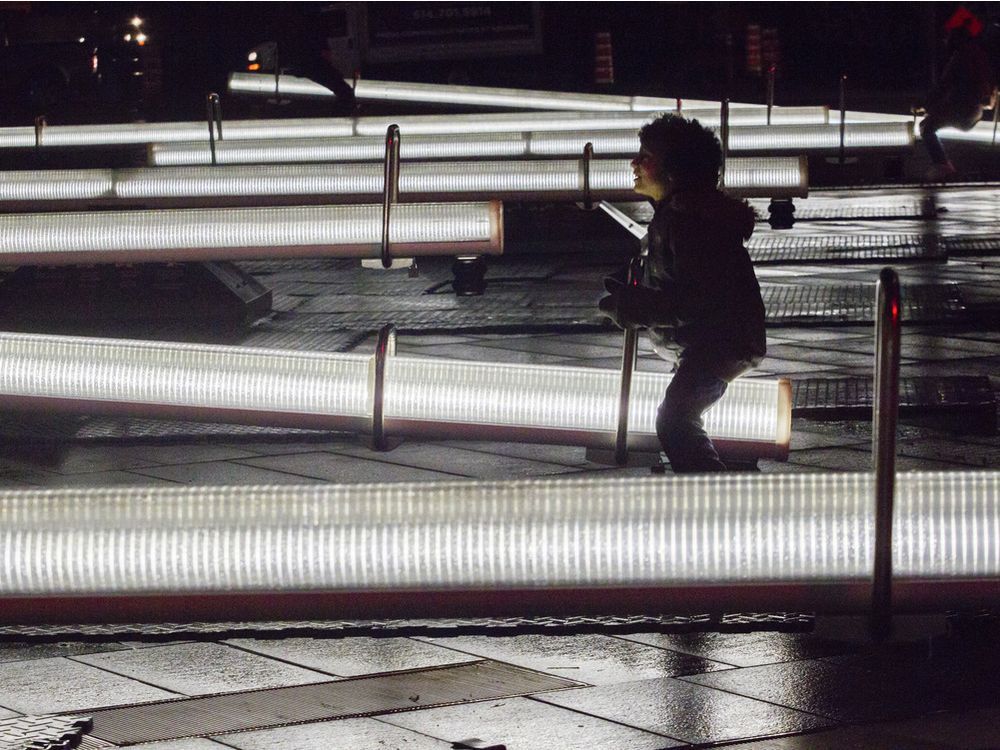  Gabriel Colley-King plays on illuminated see-saw, part of an installation that is called Impulsion, at the 12th edition of Luminothérapie in the Quartier des Spectacles.