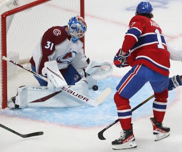 Montreal Canadiens' Josh Anderson (17) shoots puck on Colorado Avalanche goaltender Jonas Johansson during first period action in Montreal on Thursday, Dec. 2, 2021.