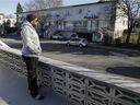 Neighbour Carlos Marin overlooks the scene in Anjou where a 20-year-old man was shot multiple times Thursday evening. The man died in hospital on Friday.