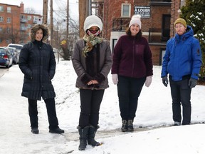 From left: Adriana Decker, Rosalind Smith, Elana Hersh and Andrew Martin gather outside the apartment buildings that became a focal point in the last municipal election.