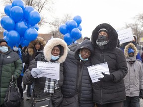 Charla Dopwell, centre, the mother of Jannai Dopwell-Bailey, participates in the Long Live Jannai walk in Montreal on Saturday, Dec. 4, 2021. Jannai Dopwell-Bailey, was a 16-year-old boy who was stabbed to death outside his school in October.