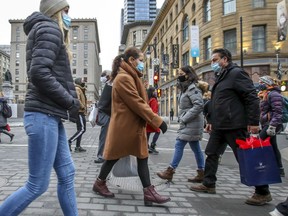 Masked pedestrians cross Union St. at Sainte-Catherine St. in Montreal Friday December 11, 2020. "If you live in Quebec, you’re a Quebecer," Martine St-Victor writes.
