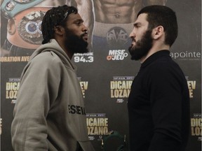 Light-heavyweight boxers Artur Beterbiev, right, of Montreal, and Marcus Browne face off at a news conference  in Montreal on Dec. 15, 2021. The pair will be fighting Friday at Bell Centre in Montreal.