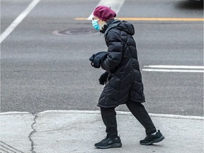 Nearly 20 per cent of Quebec cases are linked to Omicron, new analysis finds. Hospitalizations could more than double by Jan. 8 because of the new variant, Quebec projection suggests. Montrealers continue to wear masks in the Côte-des-Neiges district of Montreal on Thursday, Dec. 16, 2021.