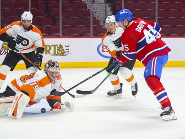 Montreal Canadiens' Laurent Dauphin's point-blank shot is stopped by Philadelphia Flyers goalie Carter Hart during first period at the Bell Centre on Thursday, Dec. 16, 2021.