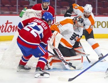 Montreal Canadiens' Cole Caufield can't jam the puck past Philadelphia Flyers' Carter Hart during first period at the Bell Centre on Thursday, Dec. 16, 2021.
