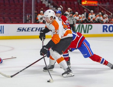 Philadelphia Flyers' Jackson Cates shoots the puck past Montreal Canadiens' goalie Cayden Primeay for his first goal of the season during second period at the Bell Centre on Thursday, Dec. 16, 2021.
