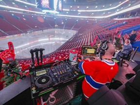 DJ Vincent Aubry prepares to work in the empty Bell Centre prior to the Montreal Canadiens game against the Philadelphia Flyers Dec. 16, 2021.