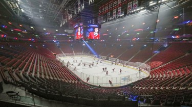 Montreal Canadiens warm up in the empty Bell Centre prior to their game against the Philadelphia Flyers on Thursday, Dec. 16, 2021.
