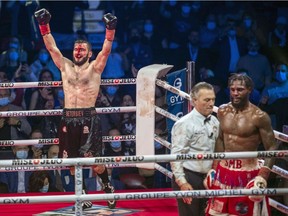 Artur Beterbiev celebrates as referee Michael Griffin stops his fight with Marcus Browne during their light-heavyweight title fight at the Bell Centre in Montreal Saturday December 18, 2021.  Beterviev won on a knockout.