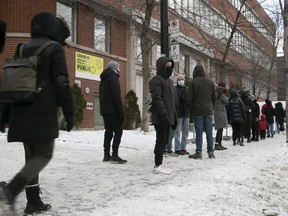 A long lineup formed outside the COVID testing centre at a CLSC on Parc Ave. on Tuesday, December 21, 2021.