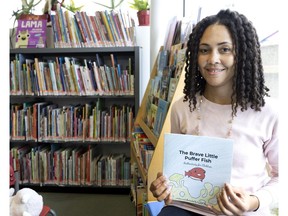 Crystal-Marie Sealy with her book, The Brave Little Puffer Fish: Authenticity for xChildren, at the Ste-Anne-de-Bellevue library last Saturday. Sealy is scheduled to read the book to children at the library on Sunday, Jan. 16 at 11 a.m.