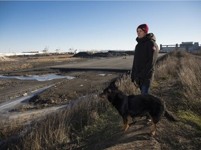 Cassandre Charbonneau-Jobin with his dog, Mishka, on an industrial site in the Hochelaga-Maisonneuve area of ​​Montreal on December 14, 2021.  The area was deserted until it was accepted by residents as a much-needed park.  Now the courts have approved it to become a container factory - doctors and locals say the last thing the area needs.