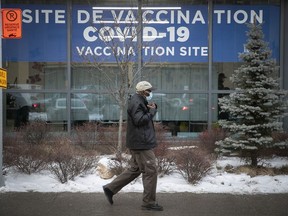 A man is on his way to the COVID-19 vaccination clinic on Parc Ave. December 29, 2021.