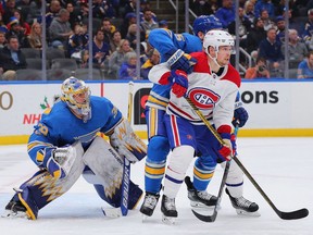 Blues' Charlie Lindgren defends the goal against Canadiens' Artturi Lehkonen during the second period at Enterprise Center on Saturday, Dec. 11, 2021, in St Louis.