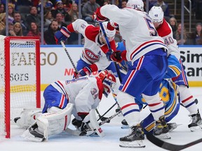 Canadiens goalie Jake Allen makes a save in a scrum against the Blues during the third period at Enterprise Center on Saturday, Dec. 11, 2021, in St Louis.
