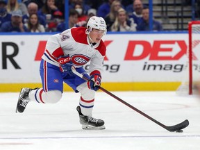 Canadiens' Corey Schueneman brings the puck up against the Tampa Bay Lightning during the third period at the Amalie Arena on Dec. 28, 2021, in Tampa.