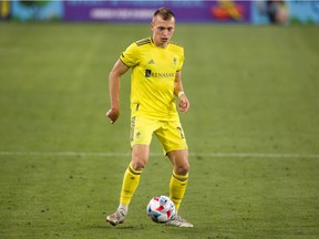 Alistair Johnston of Nashville SC controls the ball during the second half against FC Cincinnati at Nissan Stadium on April 17, 2021 in Nashville.