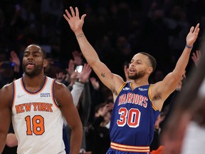 Golden State Warriors' Stephen Curry (30) celebrates after making a three- point basket to break Ray Allen's record for the most all-time against the New York Knicks at Madison Square Garden on Dec. 14, 2021, in New York City.
