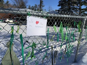Students and parents placed ribbons and a sign at a fence at Chelsea Elementary School teacher to show support for a teacher who was removed from her post because she wears a hijab.