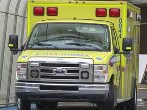 MONTREAL, QUE.: DECEMBER 1, 2020 -- An ambulance parked outside the emergency department at the Lakeshore General Hospital in Pointe Claire, west of Montreal Tuesday December 1, 2020. (John Mahoney / MONTREAL GAZETTE) ORG XMIT: 65417 - 1165