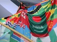 Trans rights activist and Burundi refugee Alicia Kazobinka models the Rainbow Dress at the Canadian Museum of History Tuesday. The dress includes the flags of 71 countries where homosexuality is punishable by law.