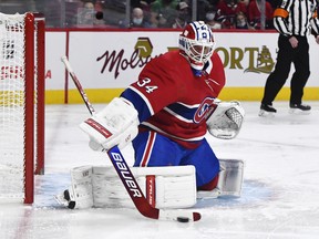 Montreal Canadiens goalie Jake Allen makes a save during the third period of the game against the Tampa Bay Lightning at the Bell Centre Dec. 7, 2021.