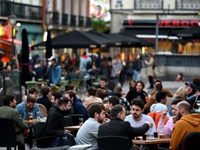Armies of tens of thousands wander Madrid on weeknights, gabbing, eating and drinking at outdoor terrasses that never seem to close, Josh Freed writes.