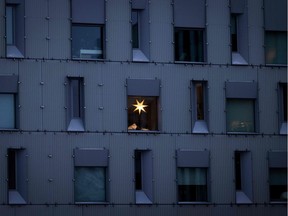 An advent star is seen in a window of an apartment building in central Oslo on December 9, 2021.