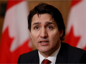 FILE PHOTO: Canada's Prime Minister Justin Trudeau takes part in a news conference in Ottawa, Ontario, Canada December 13, 2021.