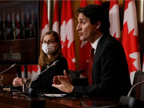 Prime Minister Justin Trudeau commented on Bill 21 at a press conference with Karina Gould, the minister of families, children and social development, in Ottawa on Dec. 13, 2021.