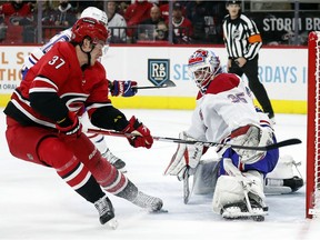 Canadiens goaltender Sam Montembeault deflects the shot of Hurricanes' Andrei Svechnikov during the second period Thursday night in Raleigh, N.C.