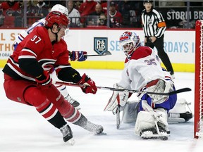 Canadiens goaltender Sam Montembeault deflects the shot of Hurricanes' Andrei Svechnikov on Thursday, Dec. 30, 2021, in Raleigh, N.C.